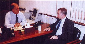 The Chairman and Roy Ellis discussing trade matter in Brian's office